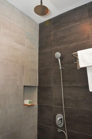 A modern shower with a handheld showerhead and a wall-mounted faucet. - De Luna Hotel Sri Petaling (Kuala Lumpur)