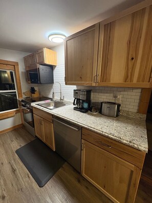 Fridge, microwave, stovetop, coffee/tea maker