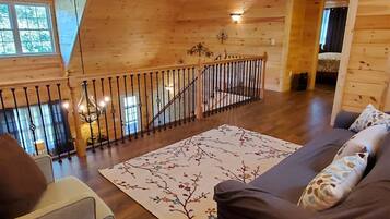 House (River_Rock_Cabin) | Living room | TV, fireplace