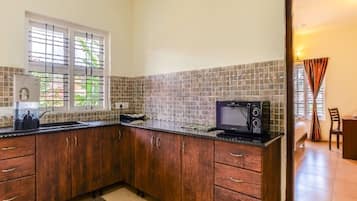 Comfort Apartment | Private kitchen | Microwave, coffee/tea maker, electric kettle, cookware/dishes/utensils