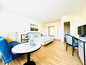 1 bedroom, desk, iron/ironing board, travel crib