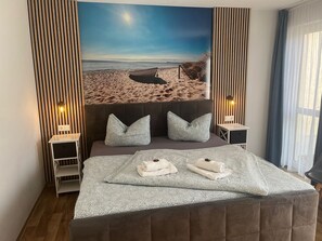 1 bedroom, desk, iron/ironing board, travel crib