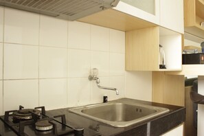 Apartment, Non Smoking, Kitchenette | Private kitchen | Fridge, stovetop, cookware/dishes/utensils - Simply Homey 2BR Apartment at Parahyangan Residence near UNPAR (Bandung)