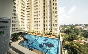 Enjoy a refreshing swim at the rooftop pool with a unique leaf-patterned design.