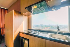 Apartment, Non Smoking, Kitchenette | Private kitchen | Fridge, cookware/dishes/utensils - Compact and Simple Studio Apartment at Saladdin Mansion (Depok)