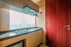 Apartment, Non Smoking, Kitchenette | Private kitchen | Fridge, cookware/dishes/utensils - Compact and Simple Studio Apartment at Saladdin Mansion (Depok)