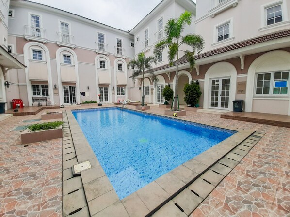 Outdoor pool - Homey Studio at Alesha Vanya Park BSD Guest House (Sharing Bathroom) (Pagedangan)