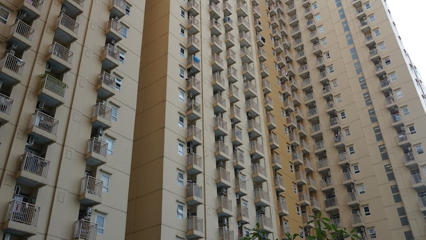 A high-rise residential building with multiple balconies and windows. - Duri Kosambi Cozy and Relaxing 3BR Apartment at Green Palm Residence (Jakarta)
