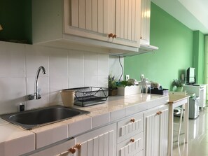 Apartment, Non Smoking, Kitchenette | 1 bedroom, iron/ironing board, free WiFi, bed sheets - Stylish & Comfortable Studio at Beverly Dago Apartment (Bandung)