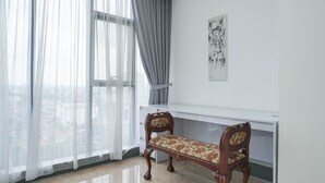 A room with a large window, a bench, and a wall-mounted shelf. - Luxury Design 1BR L'Avenue Apartment near Pancoran (Jakarta)
