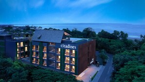 A modern building with a sign reading "citadines" and multiple balconies. - Citadines Berawa Beach Bali Resort (Canggu)