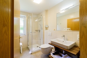 Shower, eco-friendly toiletries, hair dryer, towels