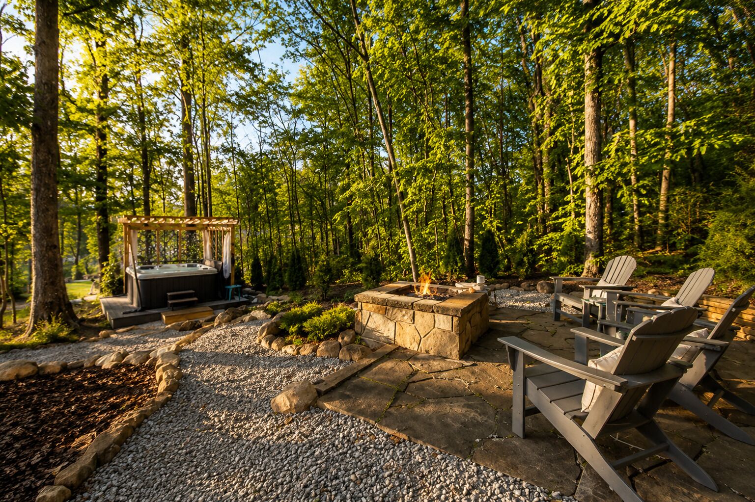An outdoor patio with a hot tub, fire pit, and Adirondack chairs.