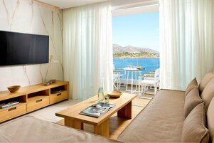 Exclusive Apartment | Living area | 43-inch Smart TV with satellite channels, TV, streaming services