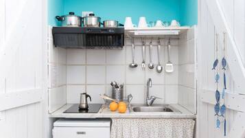 Fridge, microwave, stovetop, coffee/tea maker