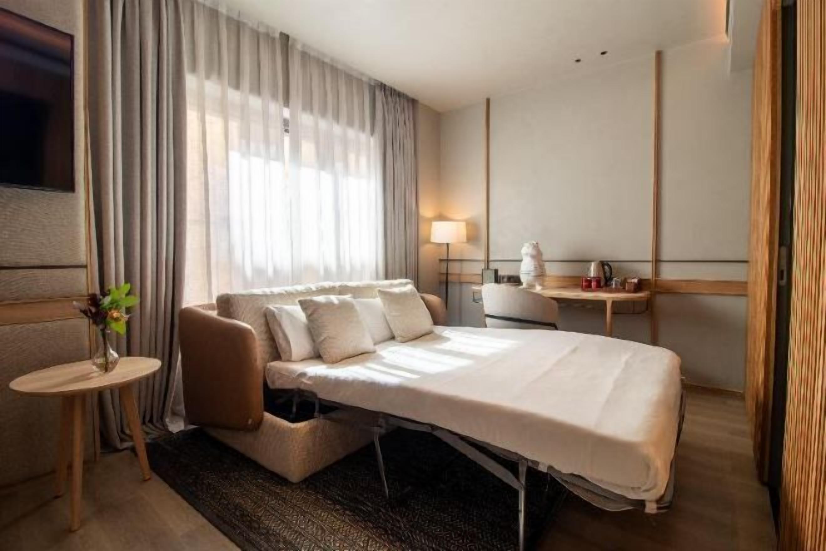 Premium bedding, memory-foam beds, minibar, in-room safe