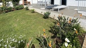 A two-story house with a white exterior and a tiled roof. - Beautiful country Villa with a small house onsite which together sleeps 6 people (Estreito da Calheta Madeira)