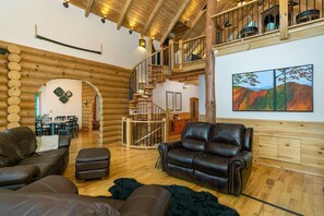 Télévision, cheminée, lecteur de DVD, baby-foot