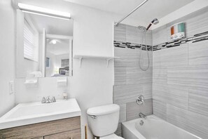 Combined shower/tub, hair dryer, towels, soap