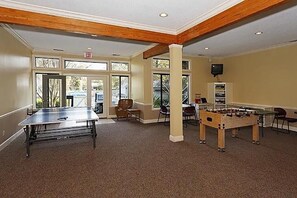 Relax and play in this spacious room with a ping pong table, foosball table, and large windows.