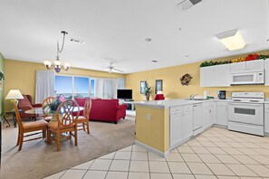 Fridge, microwave, oven, stovetop - Fourth-floor, ocean-view condo with pool, high-speed WiFi, beach access & W/D (Miramar Beach)