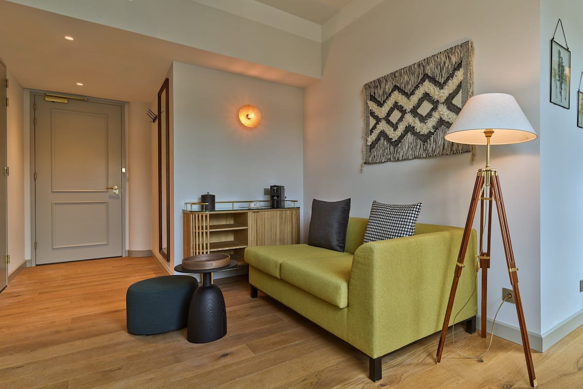 Suite, 1 King Bed with Sofa bed | Premium bedding, minibar, in-room safe, desk