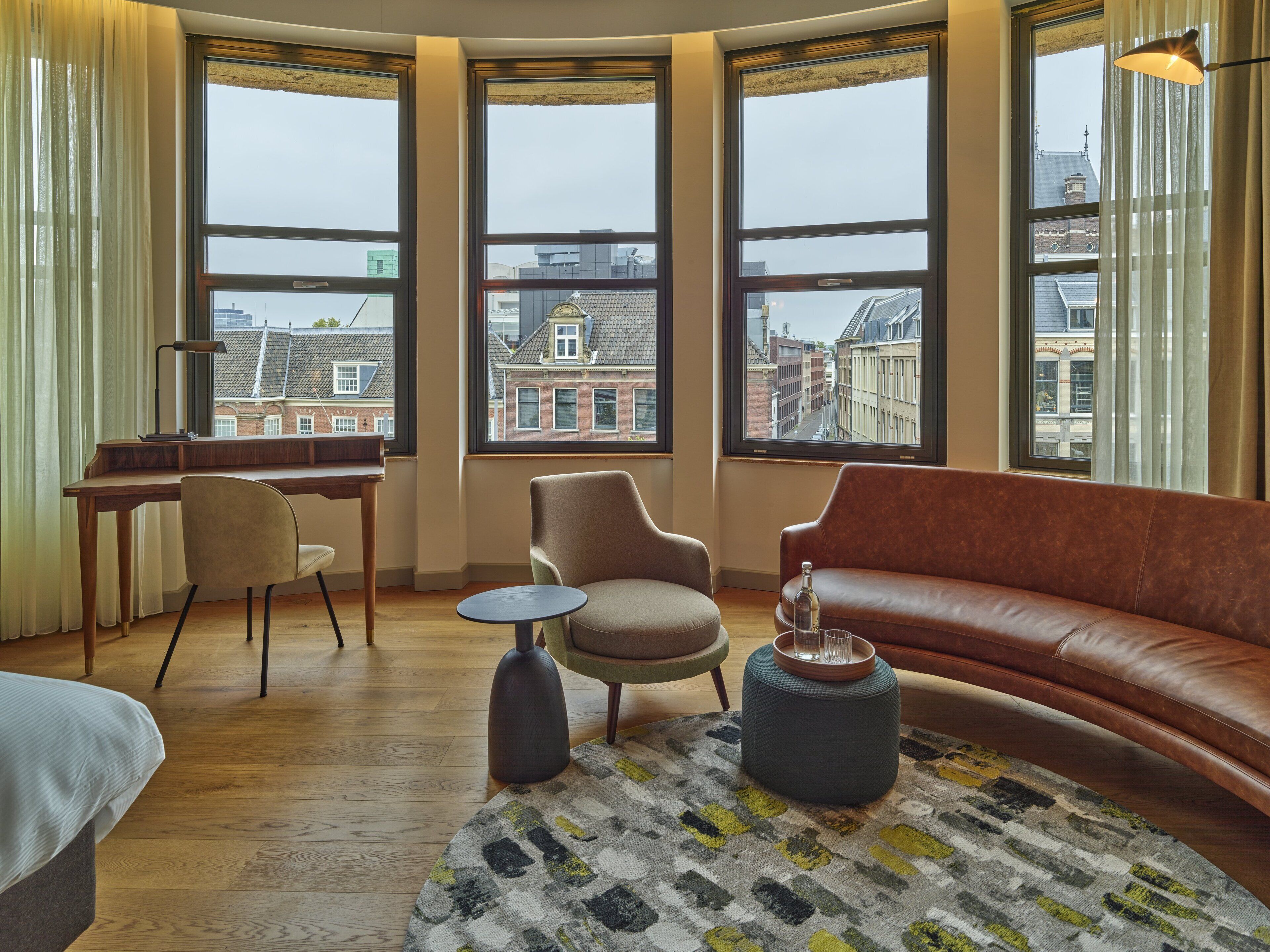 suite, 1 king bed (kneuterdijk view) | 1 bedroom, premium bedding, minibar, in-room safe