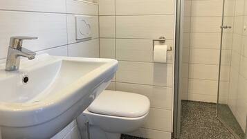 Shower, towels, soap, toilet paper