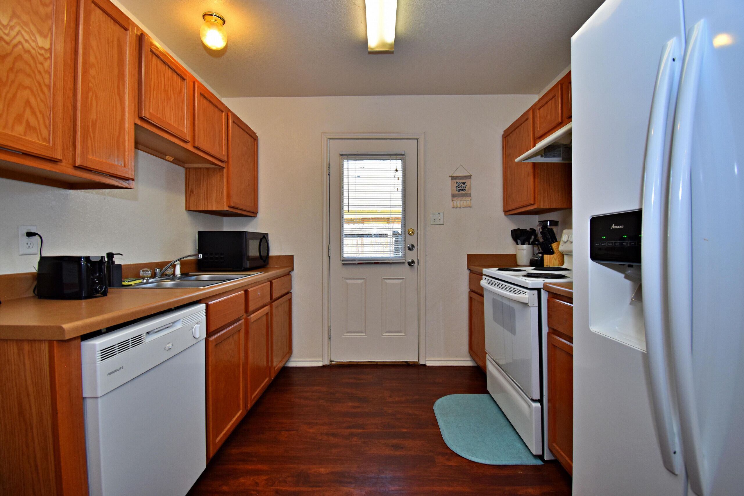 Microwave, dishwasher, coffee/tea maker, cookware/dishes/utensils