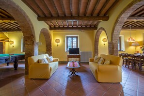 Villa | Living area | 21-inch TV with satellite channels, fireplace, DVD player
