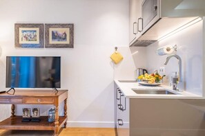 Fridge, microwave, stovetop, coffee/tea maker