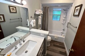 Bathtub, hair dryer, towels