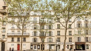A multi-story building with a ground-floor boutique hotel named "HOTEL EIFFEL KENSINGTON".