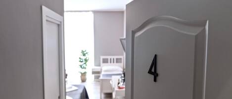 1 bedroom, desk, iron/ironing board, travel crib