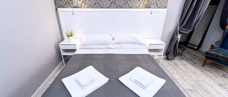 1 bedroom, desk, iron/ironing board, travel crib