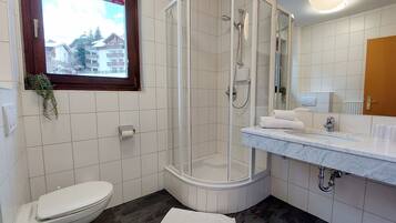 Bathtub, hair dryer, towels, soap