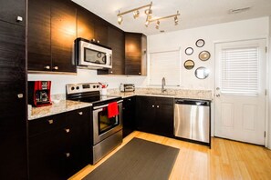 Fridge, microwave, oven, stovetop - Natural Hi / 4928 East Beach Drive - Coastal Vacation Resorts (Oak Island)