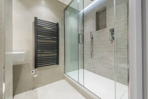 Shower, hair dryer, towels, soap