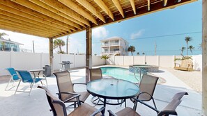 Outdoor dining - Oceanview 3-bdrm home steps from beach!  Heated pool & hot tub. Sleeps 8. (Fort Myers Beach)