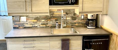 Fridge, microwave, coffee/tea maker, toaster