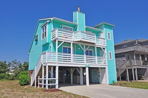 A turquoise two-story house with a white balcony and a porch. - 472 Pool,HotTub,Elevator,OceanViews,DogFriendly (Nags Head)