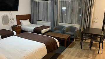 Deluxe Triple Room (Newly Renovated) | Desk, laptop workspace, iron/ironing board, free WiFi