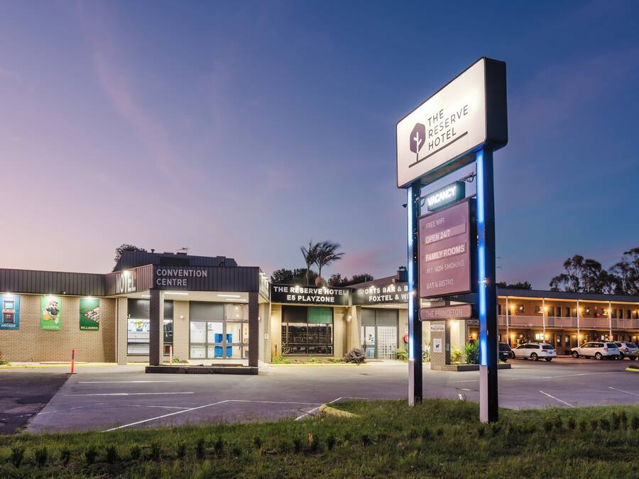 A hotel with a sign indicating it is The Reserve Hotel.