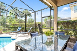 A heated pool, sun loungers