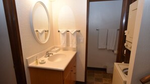 A compact bathroom with a sink, mirror, and towel rack. - Beautiful Sleep 6 condominium at CLUB TAHOE, in Incline Village Nevada. (Incline Village)