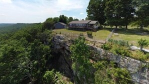 A house with a large deck overlooking a forested area. - Mountaintop View (Trenton)