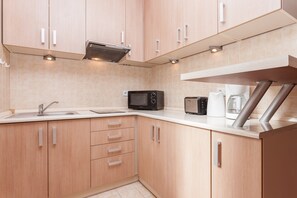 Apartment, 1 Bedroom, Balcony, Beachside | Private kitchenette | Microwave, coffee/tea maker, electric kettle, highchair