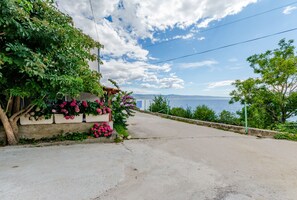 Enjoy a scenic coastal drive with breathtaking views of the sea and distant landforms.