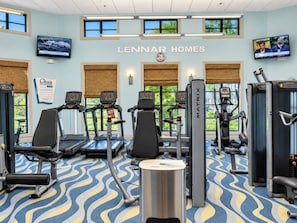A gym with treadmills, weight machines, and exercise mats.