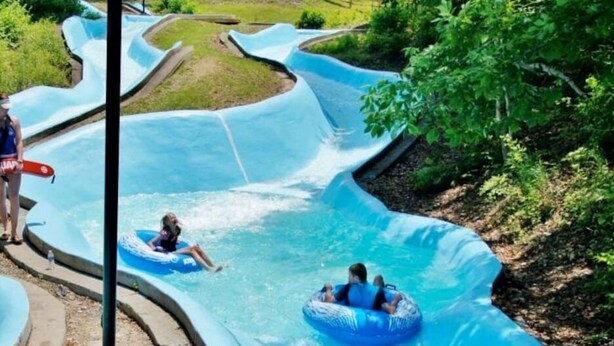 A water park with a winding water slide and inflatable tubes. - Dimmick Cozy Retreat 3 Bed 1 Bath - Sleeps 6 (West Chester Township)